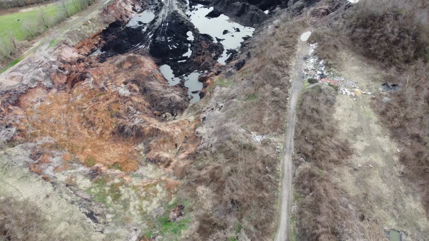 Tailings by the mine, aerial drone view. Material in Tailings. Land contamination. Mining. Open pit mine.