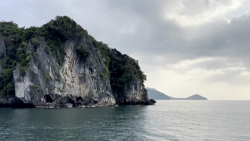 Beautiful Exploring the magnificent scenery of clear blue water surrounded by high cliffs in El Nido, Palawan.	