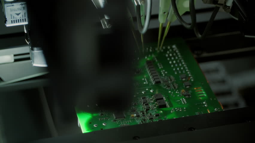 Close-up: machine installs components on circuit board. Electronic devices PCB industry. Factory of graphics processing unit, GPU processor. Production of video cards for artificial intelligence.