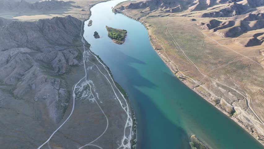 View from a quadcopter of one of the largest rivers in Kazakhstan - Ili in the Almaty region on a May evening