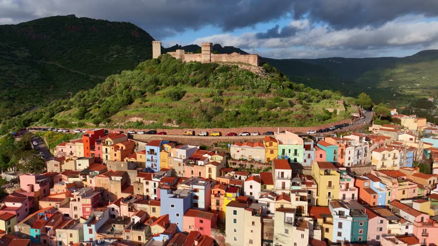 Drone shot of Sardinian town of Bosa, a historic colourful village on Sardinia island, Italy, tourism in Sardegna, Italian tourism. High quality 4k footage