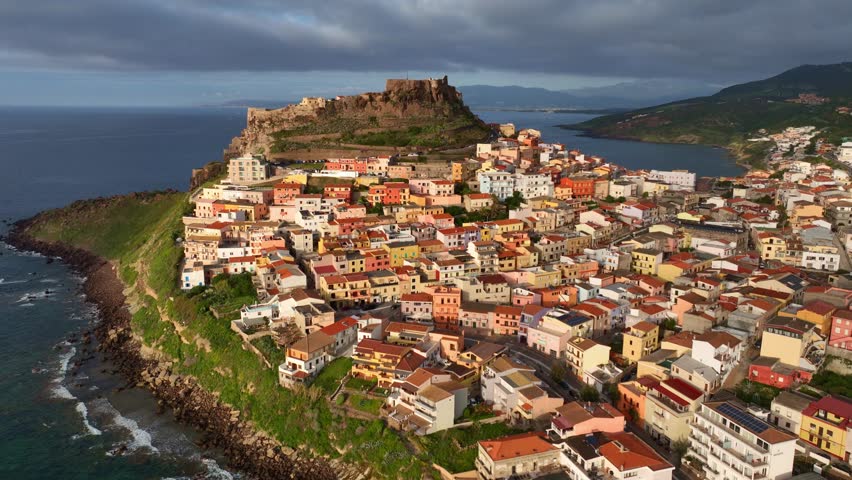 aerial view of Castelsardo historic town in Sardinia, colourful houses of a mountain town on Italian island of Sardinia, tourist destination, vacation in Sardinia