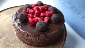 Rich chocolate cake topped with berries and truffles. - Powered by Shutterstock - Get 15% off with code: PIKWIZARD15