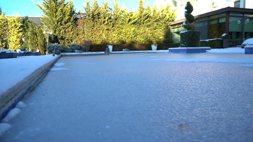 Frozen pond in the garden 4K