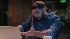Stressed businessman Indian man guy working in night overtime office Arabian angry frustrated male business entrepreneur dissatisfied talk mobile phone overwork stress problem smartphone call arguing - Powered by Shutterstock - Get 15% off with code: PIKWIZARD15