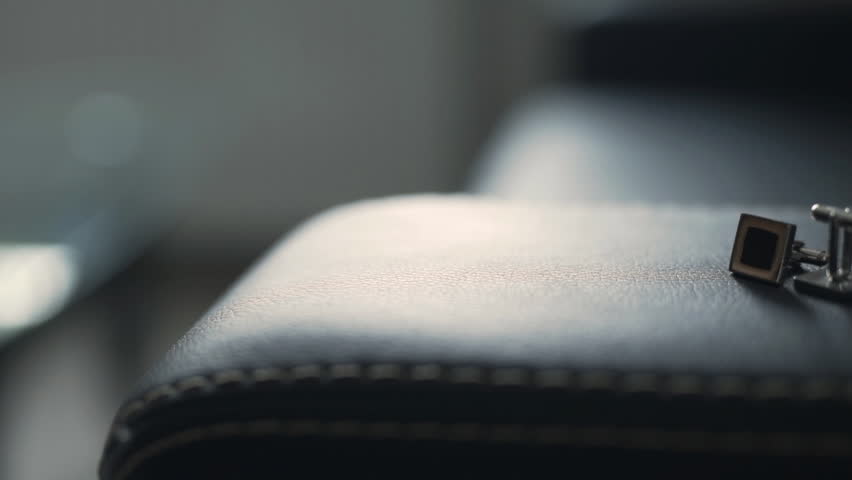 Detailed close-up shot of elegant cufflinks, perfect for formal attire or luxury accessory collections.