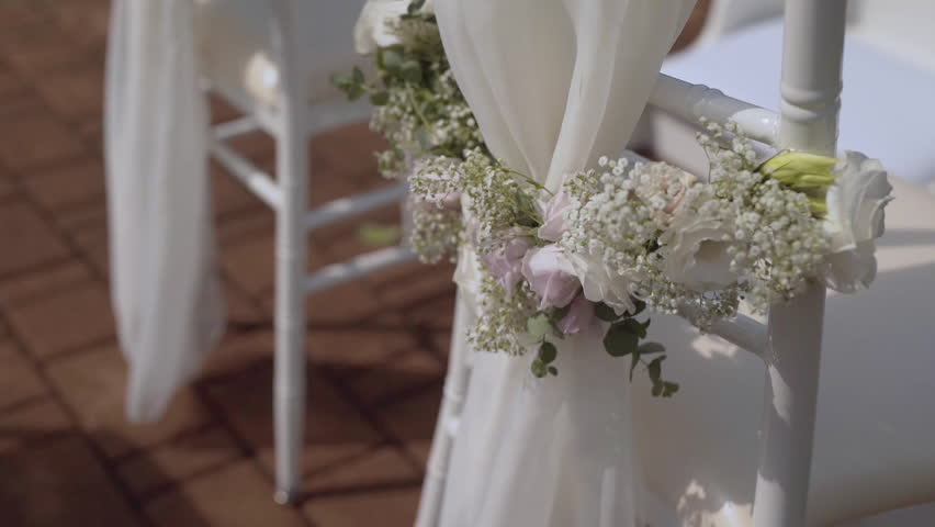 Two wedding rings in a small box placed on a glass table, showcasing elegance and romance.