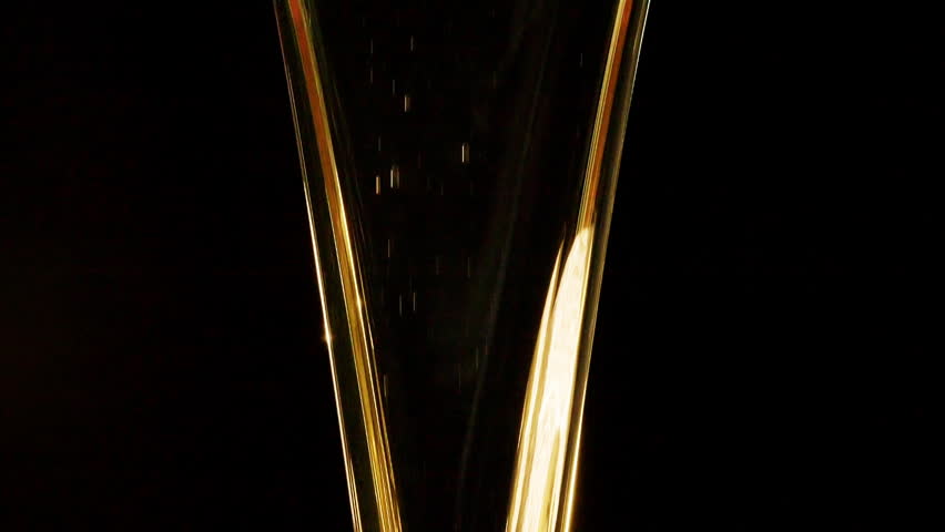 Slow motion shot of motor oil falling down on black background. 
