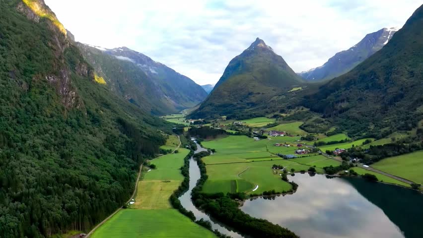 Aerial View of Serene Mountain Valley Landscape with River