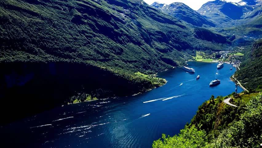 Aerial View of Fjord Landscape with Boats and Mountains