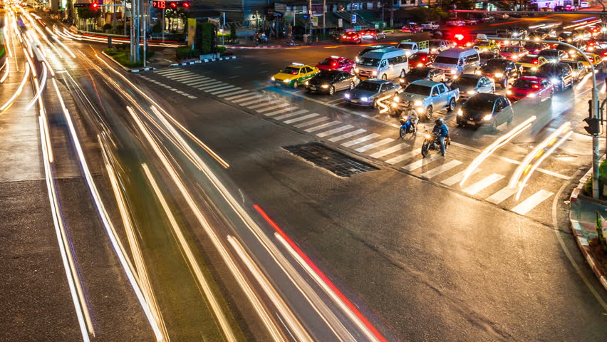 Traffic at crossing - Night time lapse in Bangkok