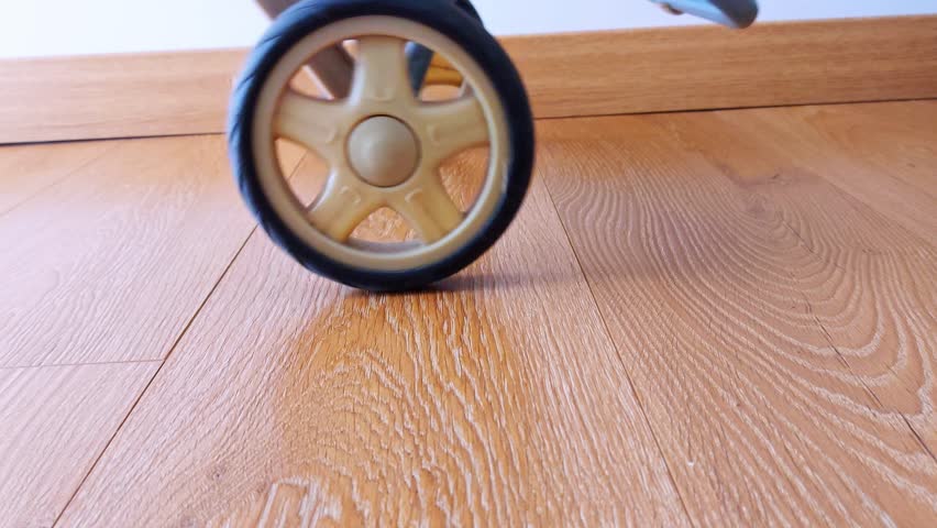 Smooth motion captured-wheel glides effortlessly over rich wooden texture, highlighting dynamic interplay