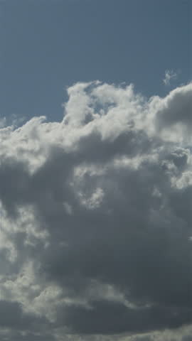 Clouds moving in blue sky. Time Lapse