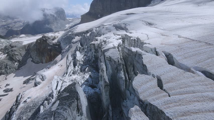 Aerial View of Snow-Capped Alpine Glacier.