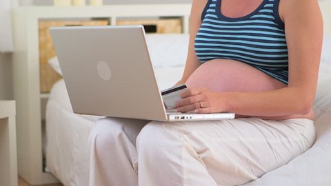 Pregnant mother using credit card online