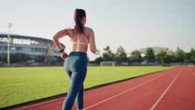 A woman is running on a track. She is wearing a white top and blue pants. The track is red and surrounded by trees - Powered by Shutterstock - Get 15% off with code: PIKWIZARD15
