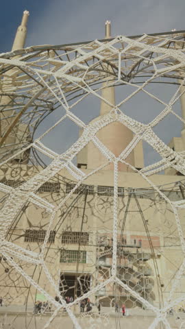 woven art pattern by the industrial towers in barcelona in vertical