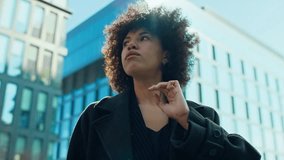 Confident woman walking to work downtown - Powered by Shutterstock - Get 15% off with code: PIKWIZARD15