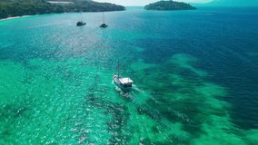 Aerial view of Playa de Formentor at Cala Pi de la Posada bay in Mallorca. Stunning beach with sailing boats floating on turquoise waters at Cap Formentor, Majorca, Balearic Islands, Spain. - Powered by Shutterstock - Get 15% off with code: PIKWIZARD15