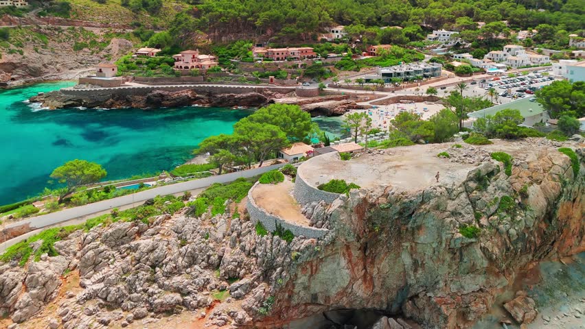 Aerial view of Cala Sant Vicent resort in Mallorca, Balearic Islands, Spain. Stunning sandy beach with turquoise waters, a popular holiday destination on Majorca island.