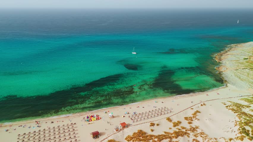 Aerial view of Cala Mesquida resort in Mallorca, Balearic Islands, Spain. Stunning sandy beach with turquoise waters, a popular holiday destination on Majorca island.