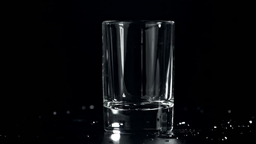 Vodka is poured into a glass. Filmed on a high-speed camera at 1000 fps. High quality FullHD footage