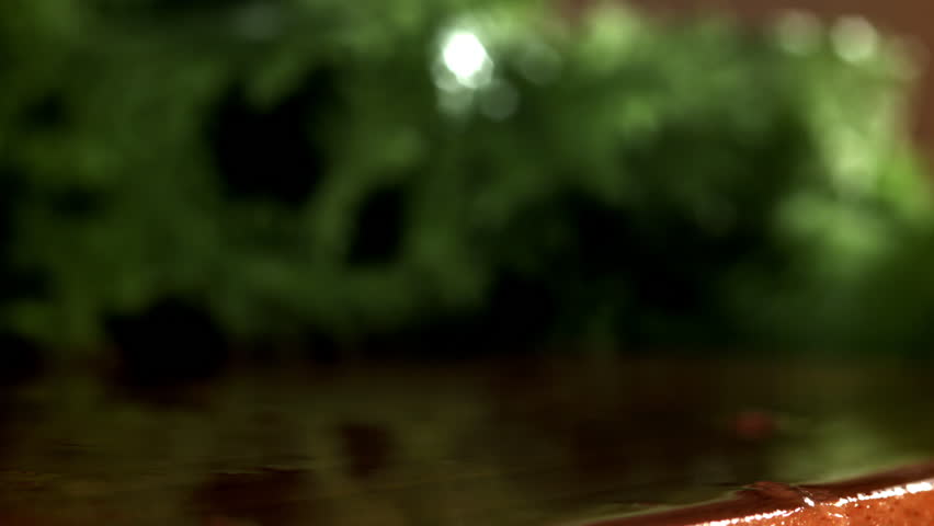 The chopped onion falls onto the cutting board. Filmed on a high-speed camera at 1000 fps. High quality FullHD footage