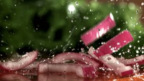 The chopped onion falls onto the cutting board. Filmed on a high-speed camera at 1000 fps. High quality FullHD footage - Powered by Shutterstock - Get 15% off with code: PIKWIZARD15
