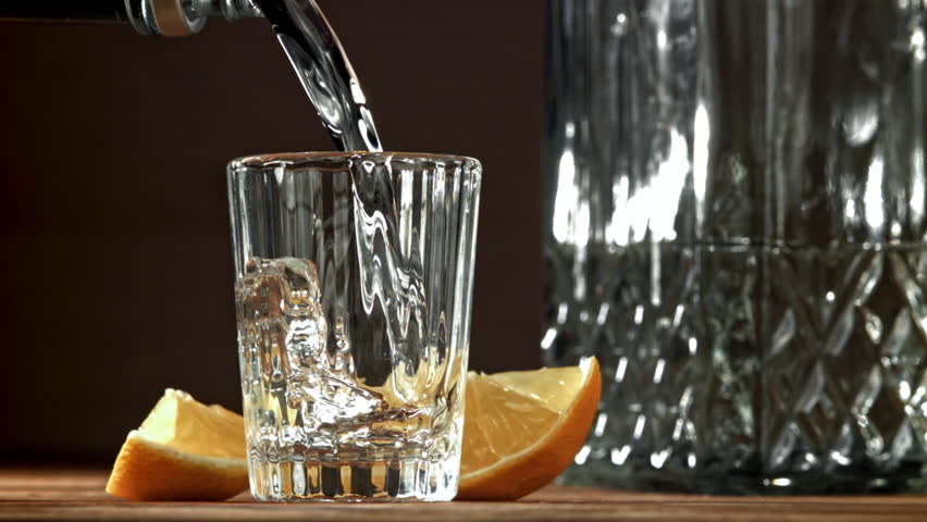 Vodka with a slice of lemon. Filmed on a high-speed camera at 1000 fps. High quality FullHD footage