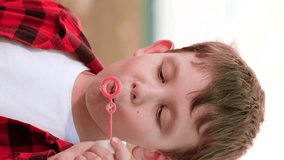 Boy blowing soap bubbles, happy child kid, peaceful childhood bubbles, pure outdoor pleasure, serene playtime child, boy bubble creation, childhood innocence play, child solo play, simple play - Powered by Shutterstock - Get 15% off with code: PIKWIZARD15