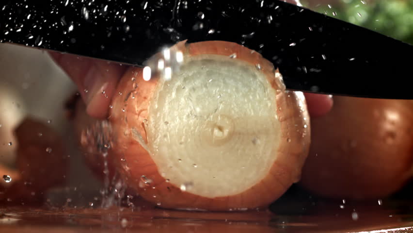 The chef chops the onion. Filmed on a high-speed camera at 1000 fps. High quality FullHD footage