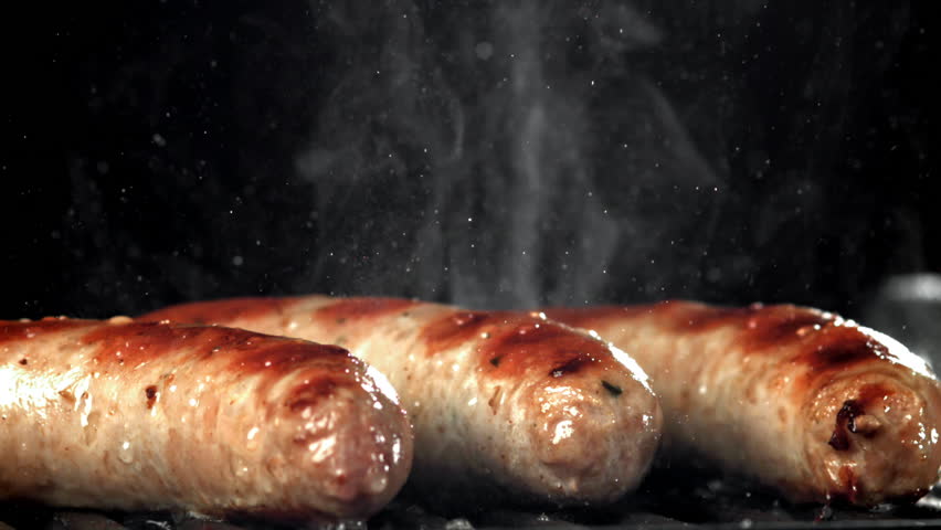 Sausages are fried in a pan with a splash of oil. Filmed on a high-speed camera at 1000 fps. High quality FullHD footage