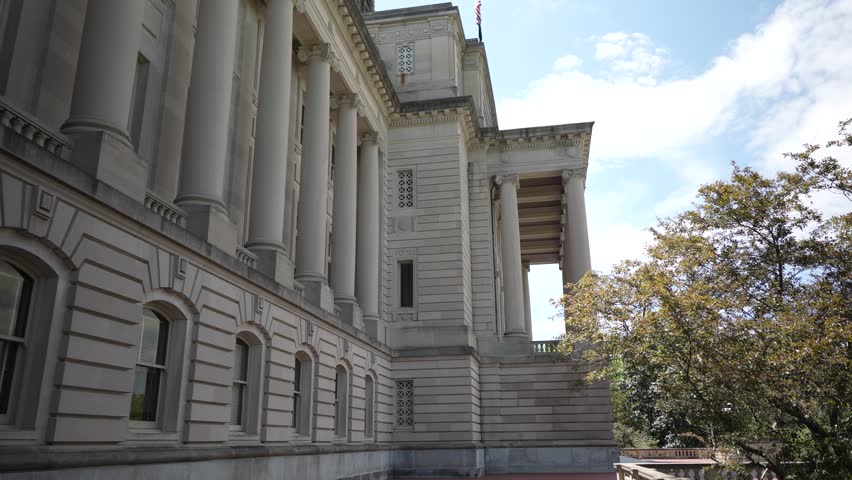 This stunning government building in Frankfort showcases detailed architecture representing Kentuckys legislative history. Sunlight highlights its grand exterior.