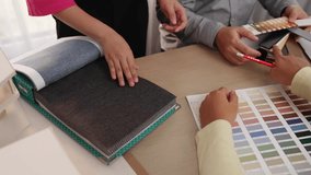 Slow motion architect team discussing about house design and material sample with client oversee the project. Interior designer brainstorm interior material at meeting room. Variegated - Powered by Shutterstock - Get 15% off with code: PIKWIZARD15