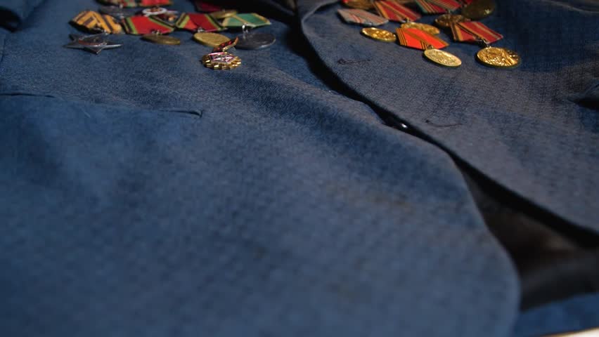 Soviet World War II Medals on Blue Fabric Background