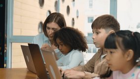 Smart teacher teaching and looking student using laptop at classroom. Professional instructor explained about programing engineering code or prompt while studying and learning program. Erudition. - Powered by Shutterstock - Get 15% off with code: PIKWIZARD15