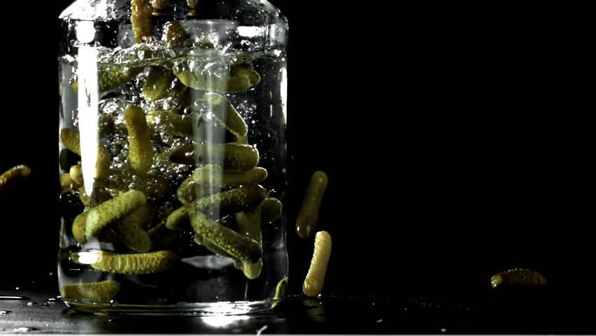 Pickled cucumbers in a jar. Filmed on a high-speed camera at 1000 fps. High quality FullHD footage