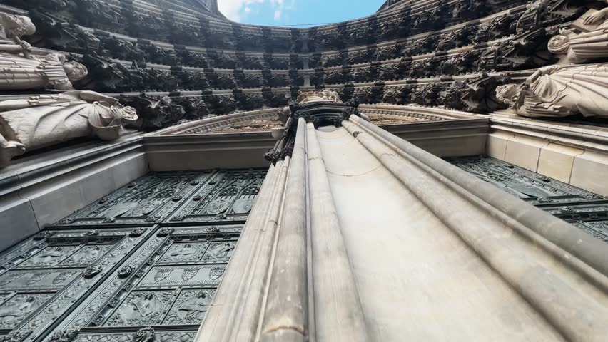 Cologne Dom cathedral seen from below with blue sky. Cologne Cathedral, or Kolner Dom, is the main landmark of Cologne and a catholic church in Germany.