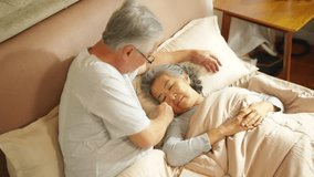 Happy Asian family senior couple sleeping on the bed and embracing with love. Elderly retired husband and wife comfort relaxing, taking care each other. Old people healthcare and family relationship. - Powered by Shutterstock - Get 15% off with code: PIKWIZARD15