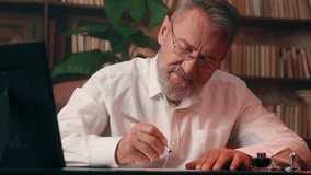 Concentrated focused elderly Caucasian man businessman writing document paperwork professor business home office indoors old male mature senior signing report write educational studying text working - Powered by Shutterstock - Get 15% off with code: PIKWIZARD15