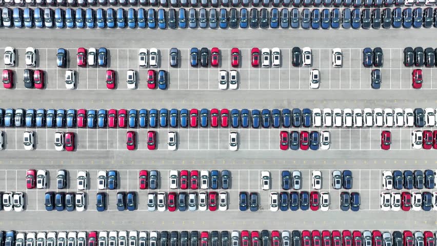 The bird's-eye view highlights the meticulous organization of vehicles in a fleet, where cars are strategically placed, reflecting the high standards of fleet management within the automotive sector.
