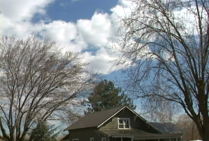 Time Lapse of farm house and clouds developing.
