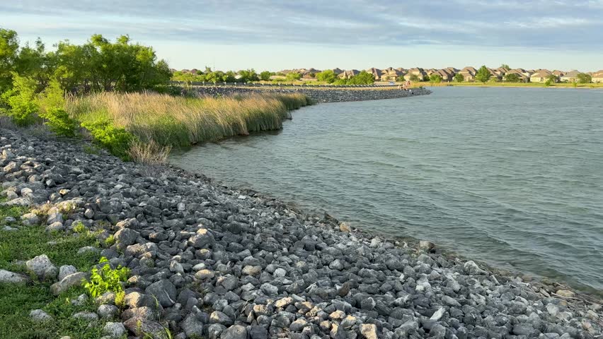 35 Curved Rocky Shoreline with Grasses and Lakeside Homes