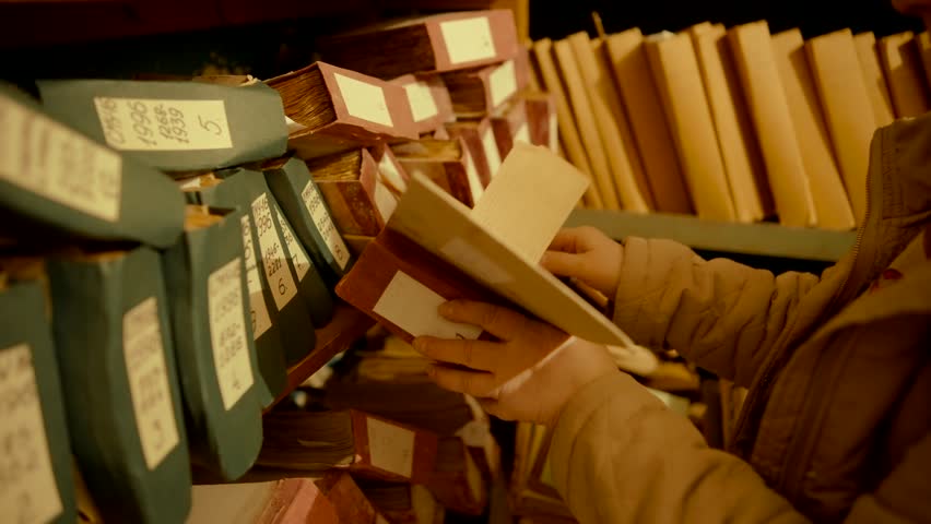 Old Document In Archive Department. Archival Material. Bookkeeping File Shelf. 
Archive Texts In Films And Reports. Highly Classified Documents. National Archives Records. Old Secret Archival Document
