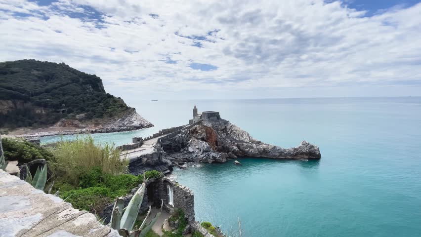 San Pietro church. Stone steps and medieval walls on rock in bay of Porto Venere, Liguria. Nature, tourism in Italy. Traditional buildings. Background for design. 