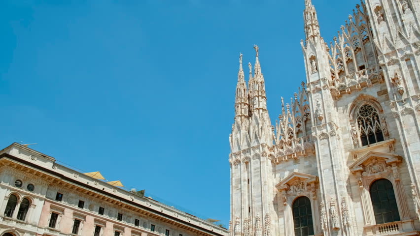 Duomo di Milano displays its elaborate Gothic facade adorned with pinnacles and spires, Milan, Lombardy, Italy

