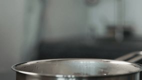 closeup of fusilli falling in a saucepan with boiling water - Powered by Shutterstock - Get 15% off with code: PIKWIZARD15