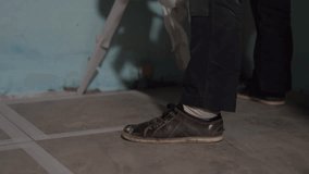 After grouting the ceramic tile joints. The masking tape is removed from the floor. Cleaning after renovation. High quality 4k footage - Powered by Shutterstock - Get 15% off with code: PIKWIZARD15