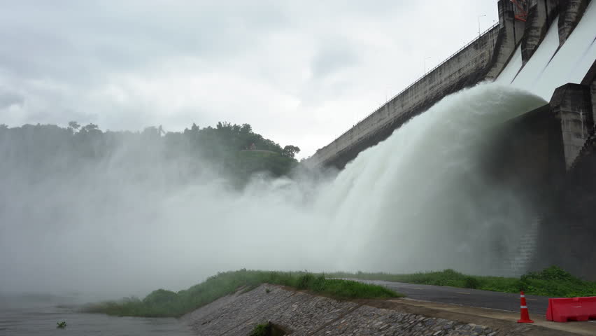Hydroelectric dam Floodgate with flowing water through gate and Open the springway Khun Dan Prakan Chon Dam in nakhon nayok Thailand