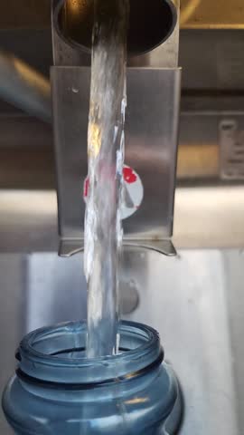 Filtered water refilling station with 5 gallon jug